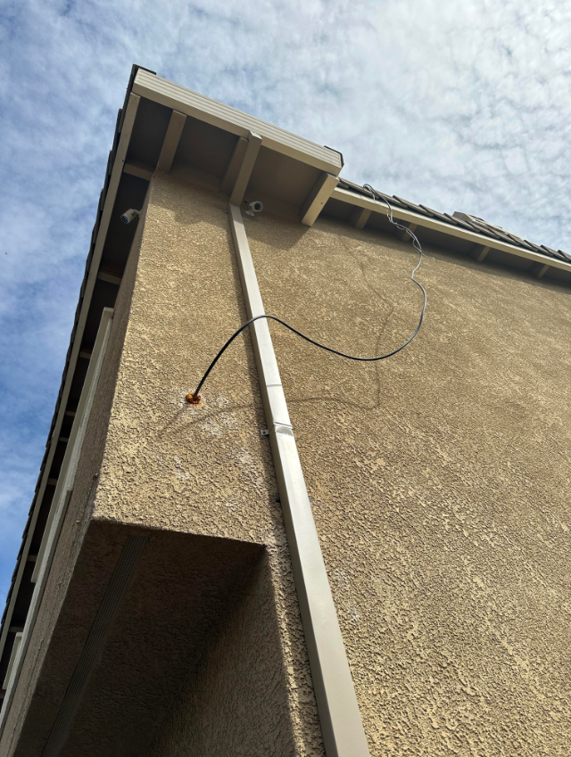 Example of uncovered cable outside a home